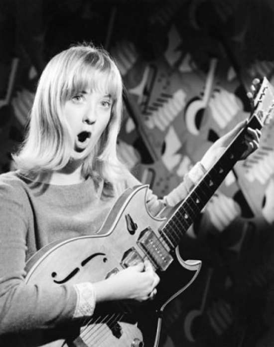 Portrait of a Young Woman Playing an Electric Guitar & Singing Poster Print - 18 x 24 in.