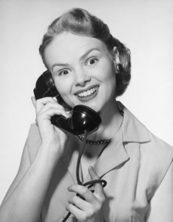 Close-Up of a Young Woman Talking on the Telephone Poster Print - 18 x 24 in.