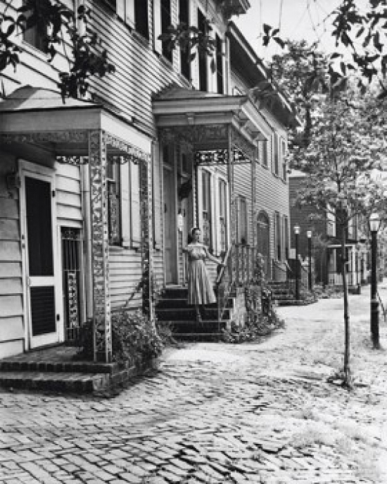 Woman Standing on the Porch of a House Savannah Georgia USA Poster Print - 18 x 24 in.