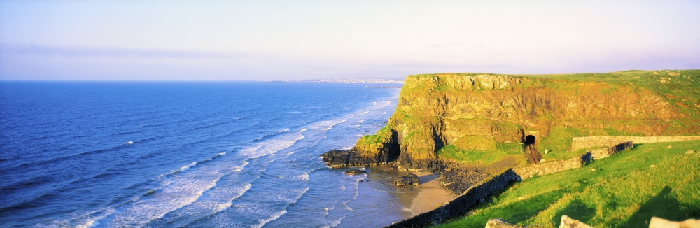 Co Derry Ireland - View of Cliffs & Ocean from Railway Line Between Downhill & Castlerock Poster Print by The Irish Image Collection, 34 x 11