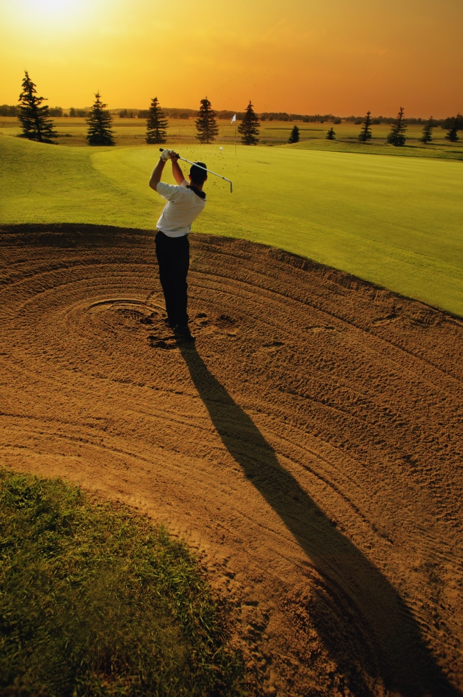 DPI1531085 Golfer Taking A Swing from A Golf Bunker Poster Print by Darren Greenwood, 11 x 17