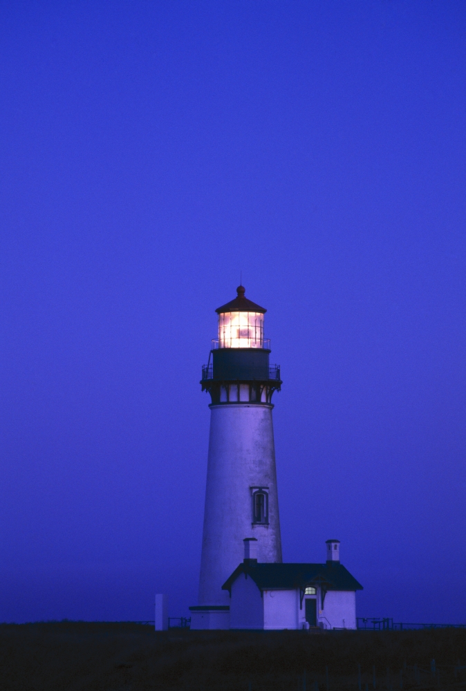 Illuminated Yaquina Head Lighthouse At Dawn Poster Print by Natural Selection Craig Tuttle, 12 x 18