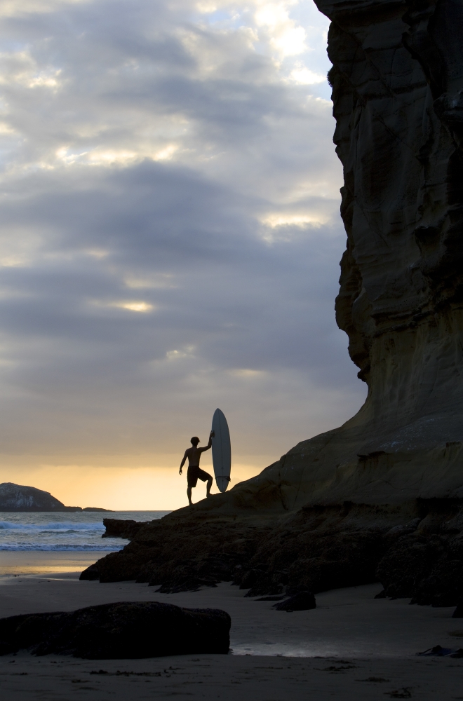 A Surfer On Muriwai Beach New Zealand Poster Print by Deddeda, 11 x 17
