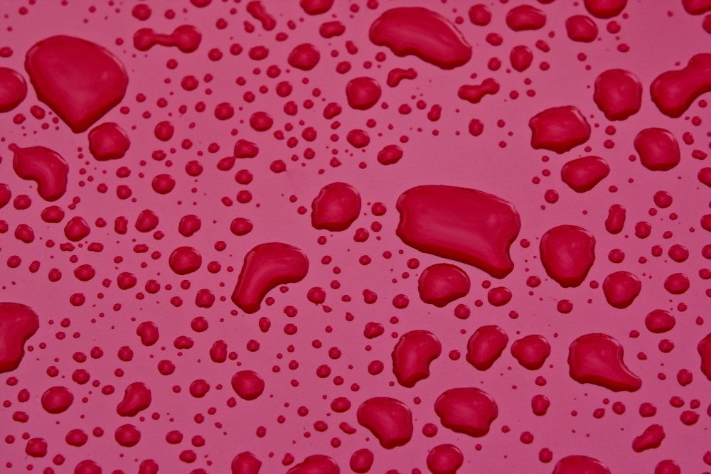 Water Drops On Pink Surface Poster Print, Large - 34 x 22