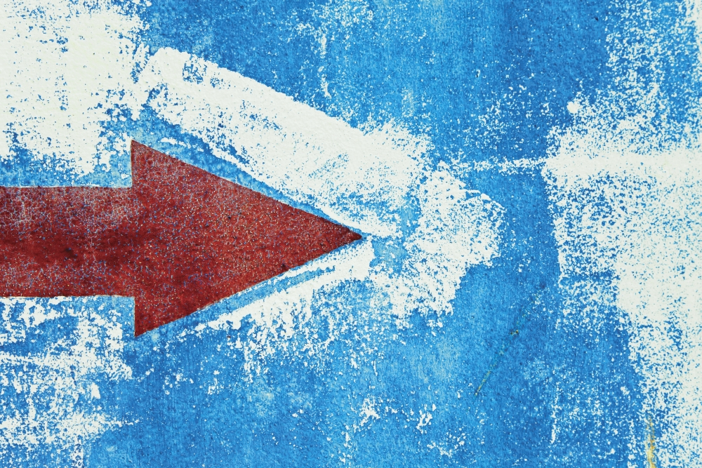 Red Arrow Painted On Blue Wall Poster Print - 17 x 11