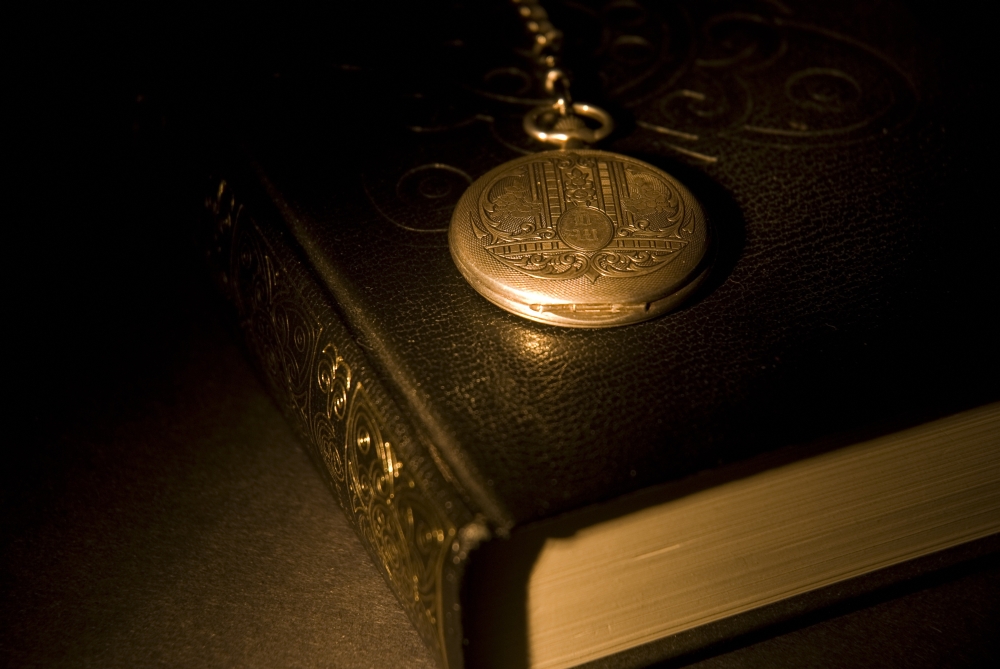 Gold Pocket Watch Resting On A Book Poster Print, 17 x 11