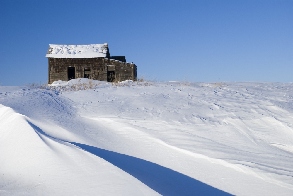 Abandoned Farm Building Atop A Snowy Hill Poster Print