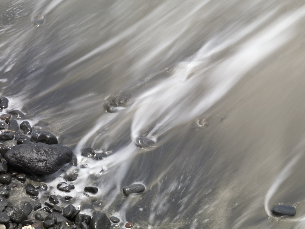 Shoreline - Water Lapping Up Against A Rocky Shoreline Poster Print