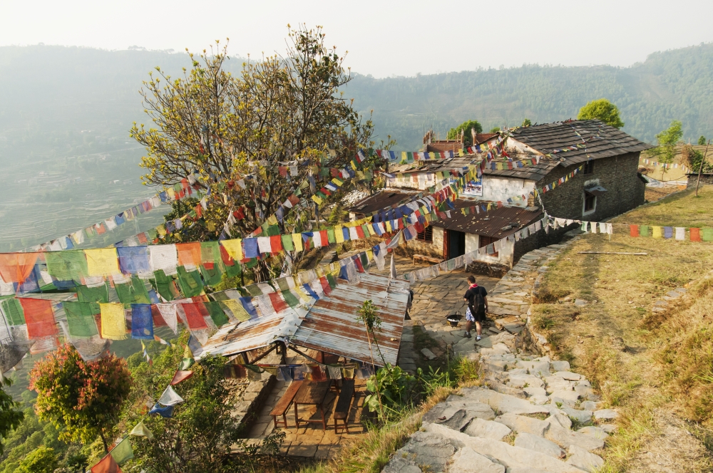 Annapurnas Route in Nepal Through Gandruk Village A Tibetan House Decorated with Their Traditional 5 Colors Tibetan Fla Poster Print - 19 x 12 in.