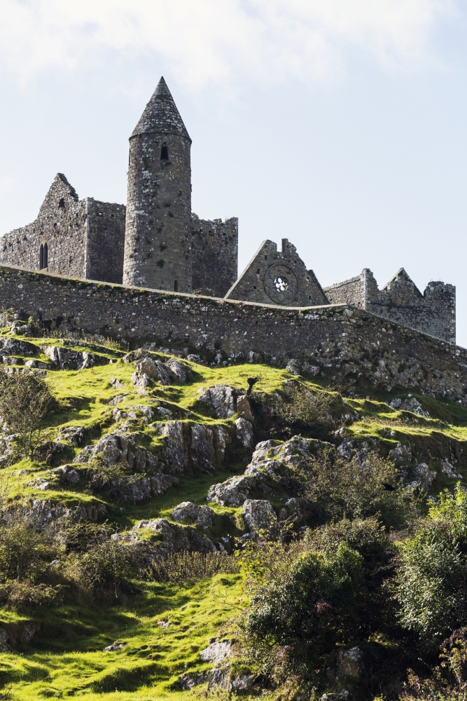 Ancient Stone Ruin with Stone Wall Turret & Church on Rocky Grassy Hillside Poster Print - 24 x 38 in. - Large