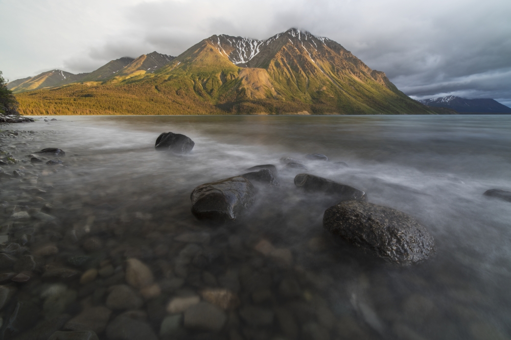 Long Exposure of Kathleen Lake Washing Over The Rocks As The Setting Sun Hits Kings Throne Kluane National Park - Yukon Poster Print - 19 x 12 in.