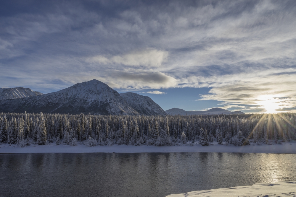 The Sun Breaks Through The Clouds Above The Takhini River on A Late Winter Poster Print - 38 x 24 in. - Large