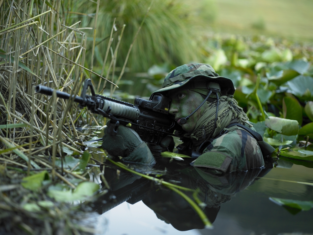 Picture of StockTrek Images PSTTWE300052M U.S. Navy Seal Crosses Through A Stream During Combat Operations Poster Print, 16 x 12