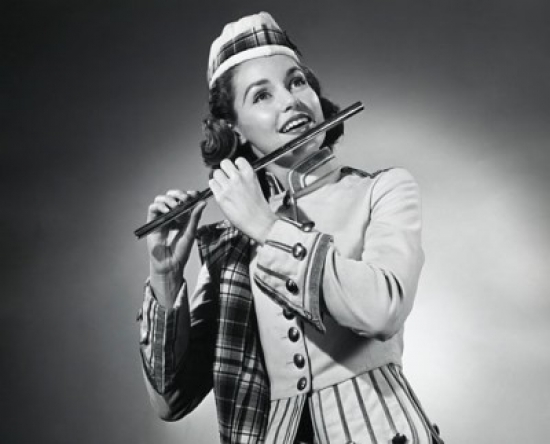 Close-Up of A Young Woman Playing A Flute Poster Print - 18 x 24