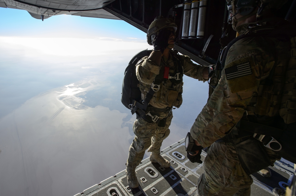 Picture of   November 19 2013 - U.S. Air Force Pararescueman Salutes A Combat Rescue Officer Moments Before Jumping From A Hc-130 Hercules Near Camp Lemonnier Djibouti Poster Print&#44; 34 x 22 - Large