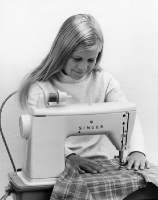 Girl At Sewing Machine Poster Print, 18 x 24