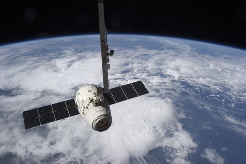 The Spacex Dragon Cargo Craft Prior To Being Released by The Canadarm2 Robotic Arm Poster Print