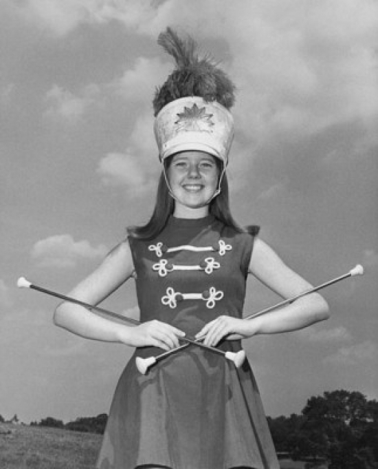 Superstock SAL25524693B Drum Majorette Performing with Two Twirling Batons & Smiling Poster Print, 18 x 24 -  Posterazzi