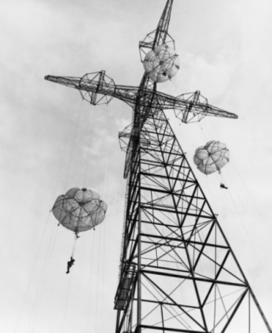 Low Angle View of Army Soldiers Parachuting From A Tower At A Training Center Fort Benning South Georgia USA 24 September 1949 Poster Print - 18 x 24
