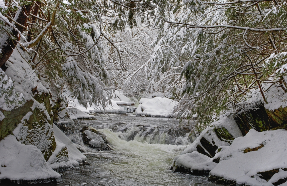Water Flowing in A River with Snow Covered Shoreline - Fulford Quebec Canada Poster Print - 38 x 24 in. - Large