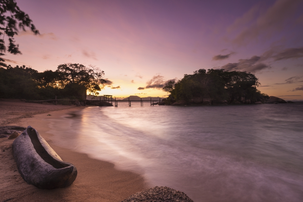 DPI12268465 Dugout Canoe on Small Beach on Mumbo Island Lake Malawi - Malawi Poster Print - 19 x 12 in.