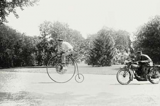 Motorcycle Cop Chases A Penny Farthing Velocipede Poster Print by Unknown - 24 x 36 - Large