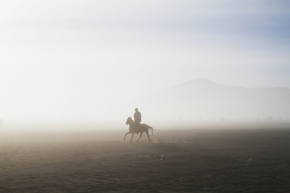 Man Riding A Horse in The Tengger Sand Sea Bromo Tengger Semeru National Park East Java Indonesia Print 38 x 24 in.