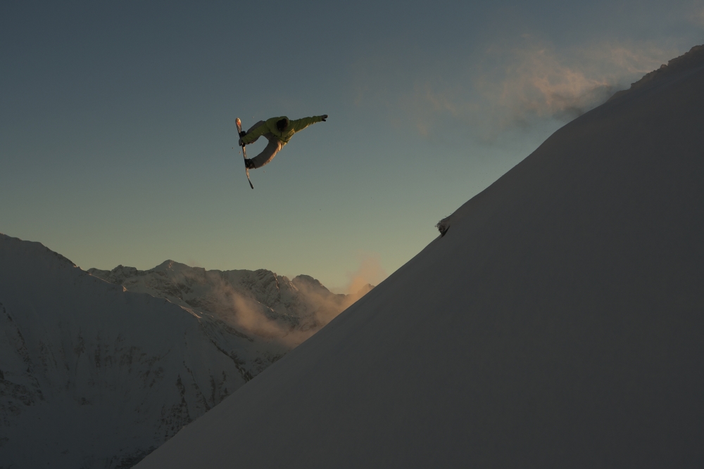 Professional Snowboarder Frederik Kalbermatten Extreme Snowboarding at Sunset Arlberg Austria Poster Print - 38 x 24 in. - Large