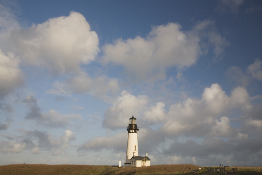 Lighthouse with Cloudy Backdrop Poster Print - 19 x 12