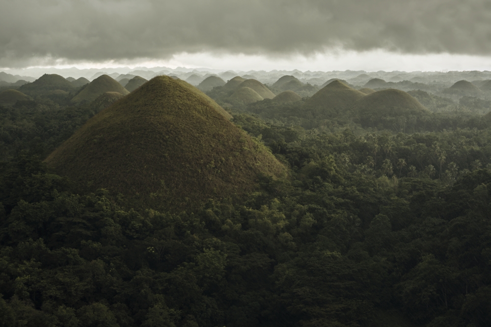 Chocolate Hills Landscape From Bohol Island A Big Storm Covers The Sky Making An Interesting Lighting Effect 1 Poster Print