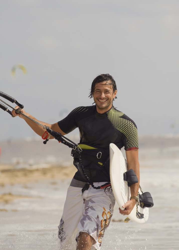 Man Carrying Kitesurfing Board Poster Print, 24 x 34