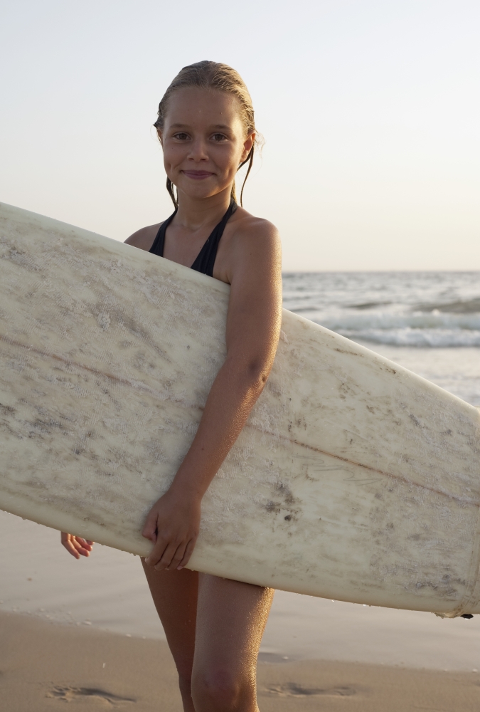Young Girl with Surfboard Poster Print, 22 x 34