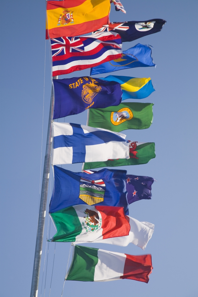 International Flags on A Flagpole Poster Print - 24 x 36