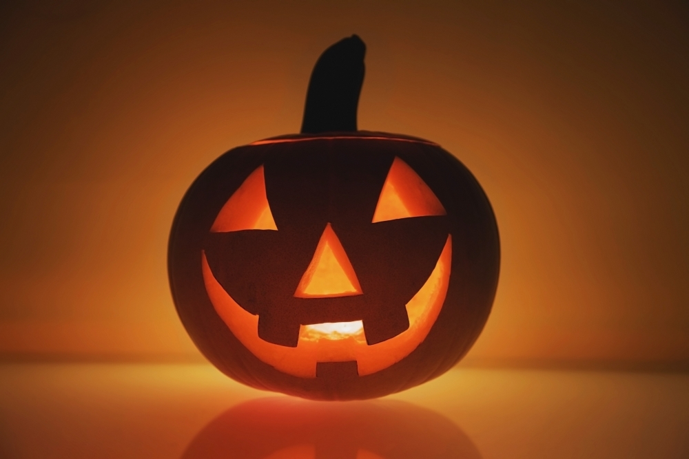 A Pumpkin Carved Into A Happy Face Poster Print, 19 x 12
