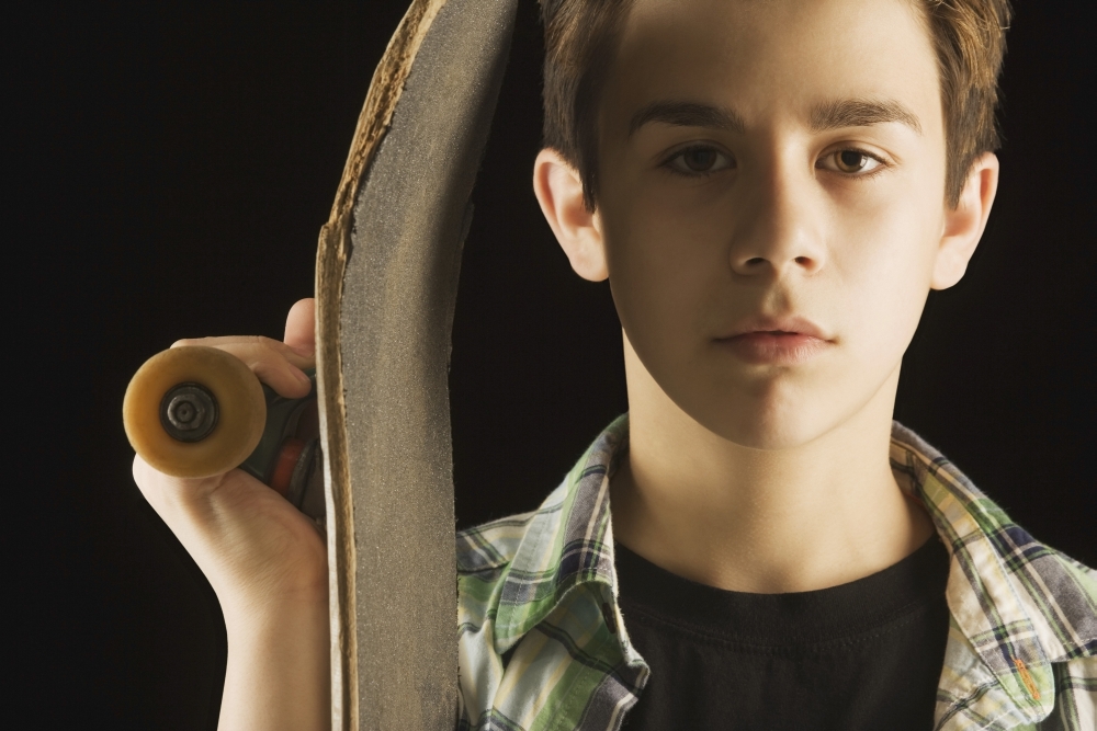 A Boy with A Skateboard Poster Print - 19 x 12