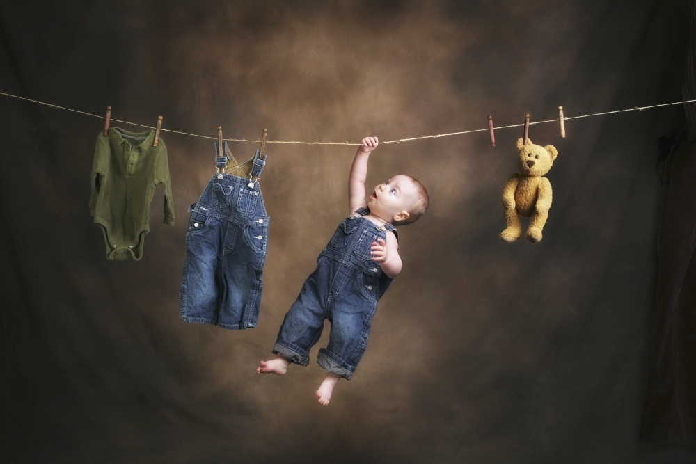 A Baby On The Clothesline Poster Print 38 x 24 - Large