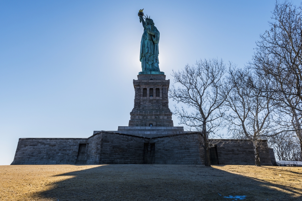 DPI12275722LARGE Sun Setting Behind The Statue of Liberty Liberty Island - New York City United States of America Poster Print - 38 x 24 in. - Large
