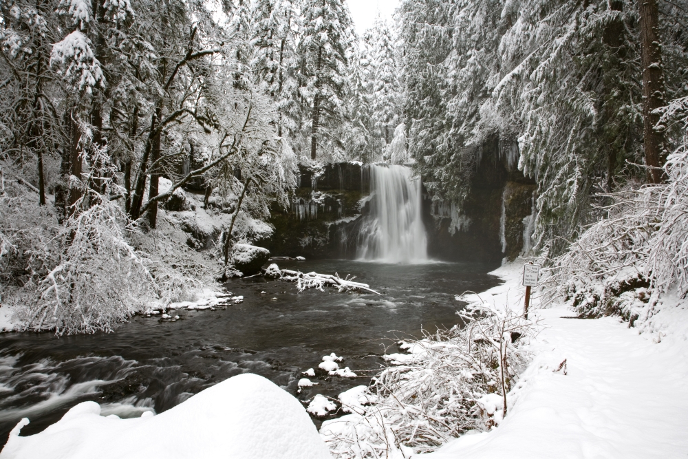A Waterfall In to A River In Winter Poster Print, 36 x 24 - Large
