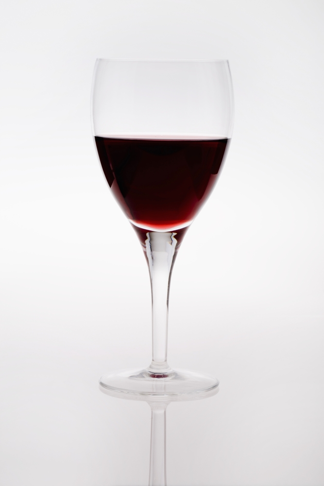 A Wine Glass with Red Wine Poster Print - 12 x 19