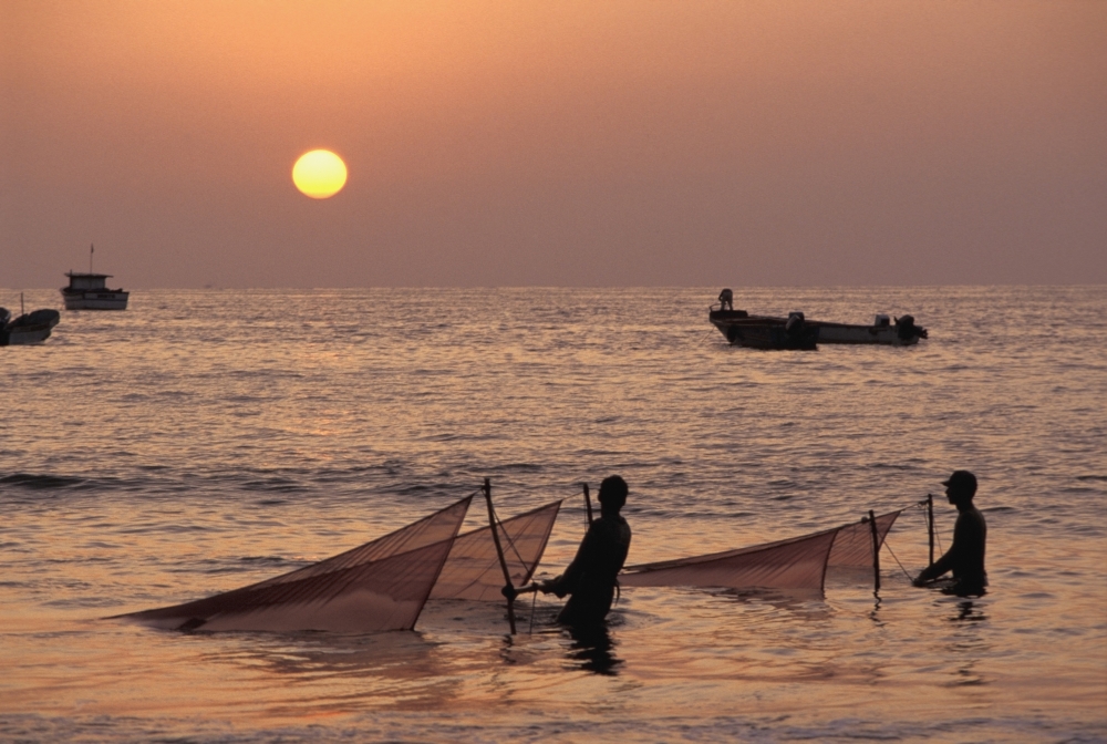 Fishermen Holding Nets In Sea At Sunset Poster Print, 17 x 11