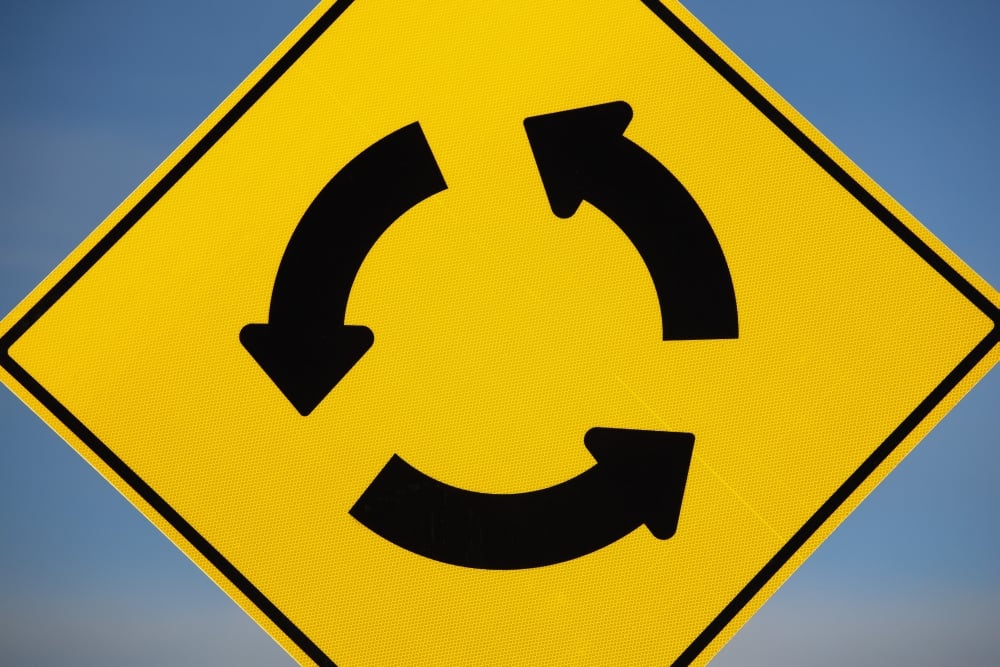 A Yellow Sign Showing Three Arrows Going In A Circle - Calgary, Alberta, Canada Poster Print, 38 x 24 - Large