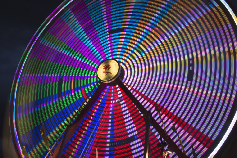Light Effect of A Fairground Ride at Night at The Calgary Stampede - Calgary Alberta Canada Poster Print - 19 x 12 in.