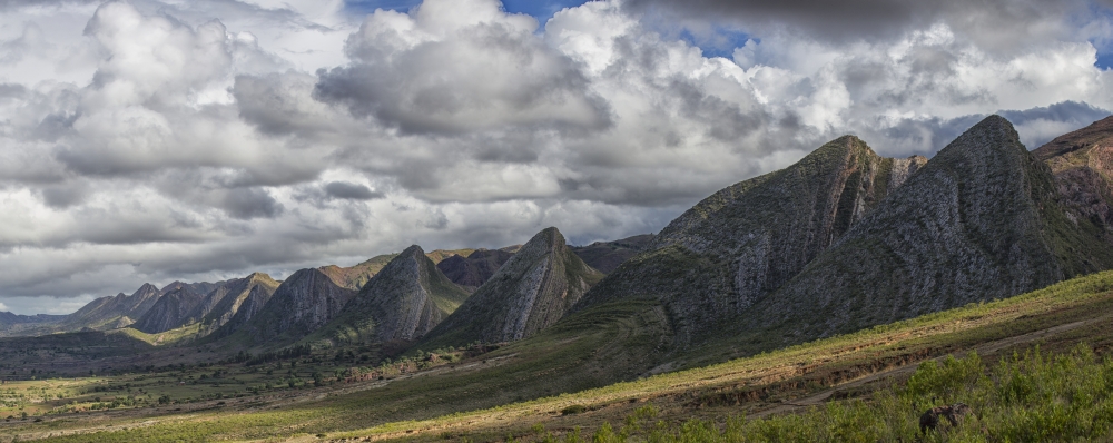 Near Vertical Sandstone Beds Form A Sinuous Hogs Back of Prominent Multicolored Ridges in Toro Toro National Park Poster Print - 34 x 13 in.