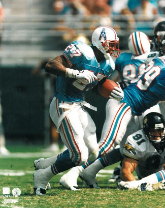 Picture of Athlon CTBL-015380 Eddie George Unsigned Tennessee Oilers 8 x 10 Photo with No.27 Blue Jersey vs Jaguars