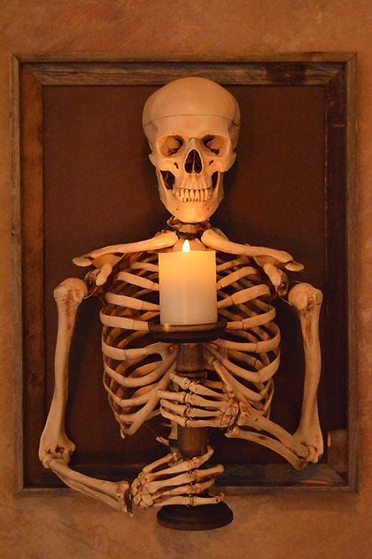 Framed 3D Harvey Skeleton Torso Holding Flameless Candle