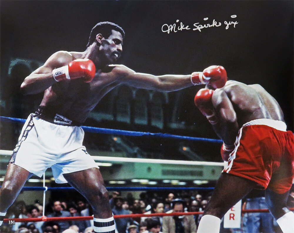 SPI16P512 16 x 20 in. Michael Spinks Signed Boxing Punching Action Photo with Jinx Inscription