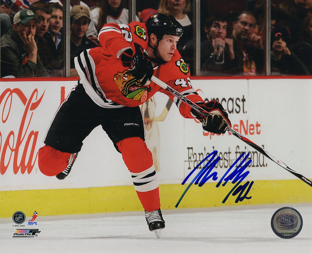 Picture of Schwartz Sports Memorabilia HEN08P402 8 x 10 in. Jordan Hendry Signed Blackhawks Red Jersey Action Photo with No. 42