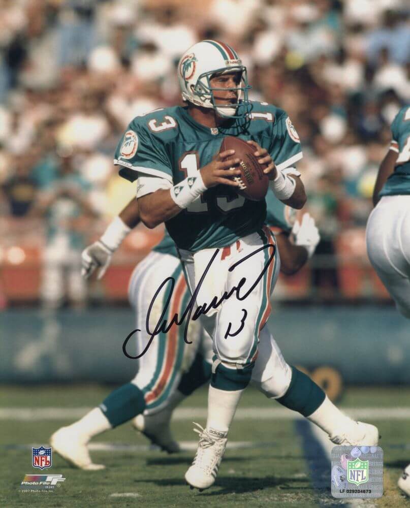 MAR08P308 8 x 10 in. Dan Marino Signed Miami Dolphins Drop Back Teal Jersey Action Photo