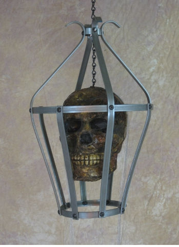 Skull cage with corpsed head skull