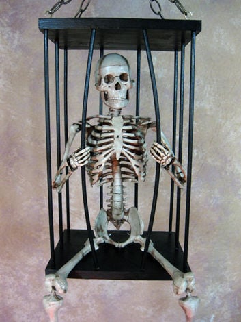 CAGE-400 Med. Skeleton breaking out of cage